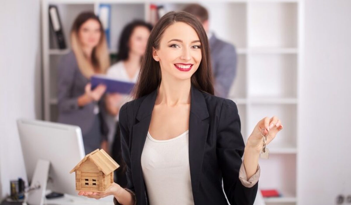 Real estate agent portrait with family getting new home. business concept about real estate market